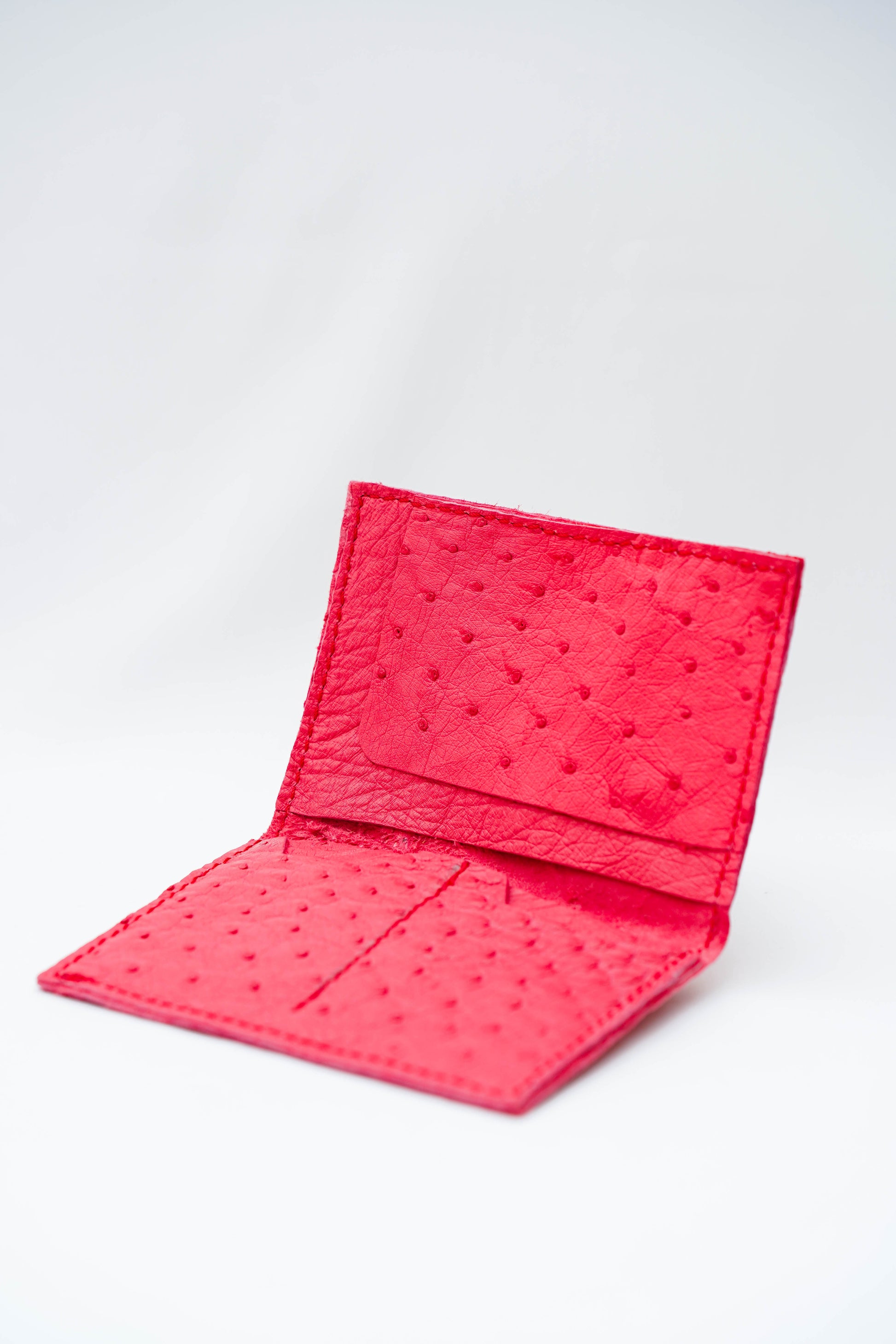 Portefeuille amarante                      Veritable peau d’autruche